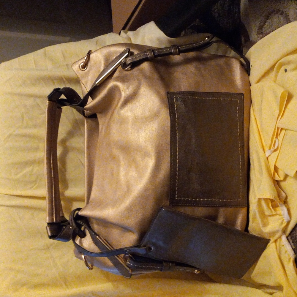 A light tan leather Light tan in color size large